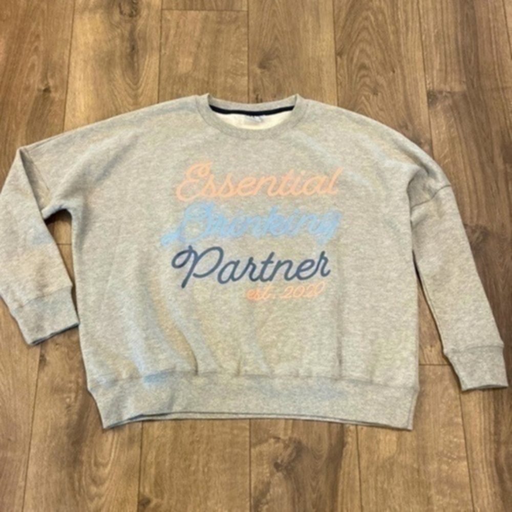 “Essential Drinking Partner” sweatshirt